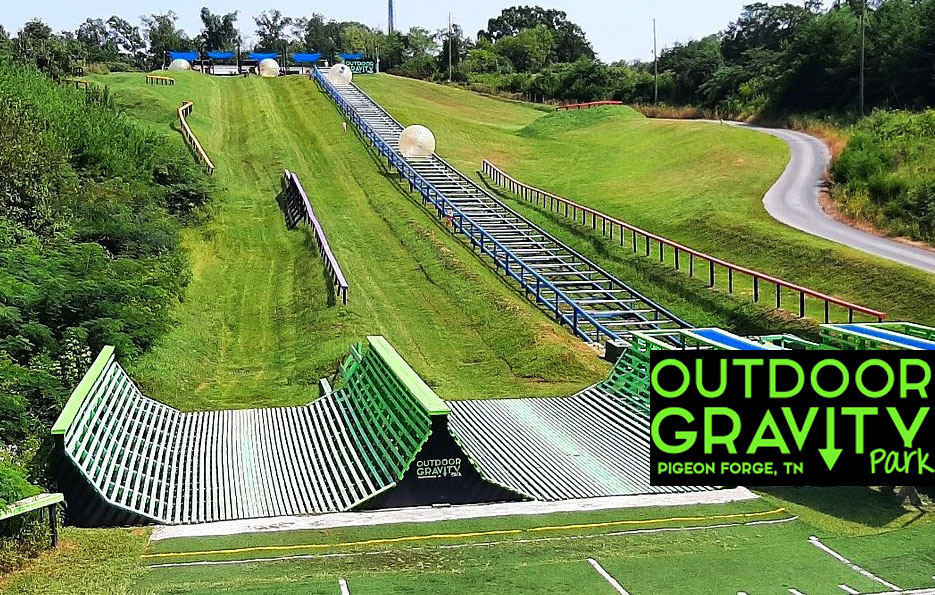 downhill zorbing track with inflatable balls rolling on it, at OGO Zorbing Park, USA